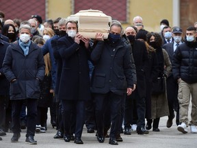 Former Italy player Marco Tardelli and 1982 World cup teammates carry the coffin of Paolo Rossi outside the Vicenza Cathedral in Vicenza, Italy, Dec. 12, 2020