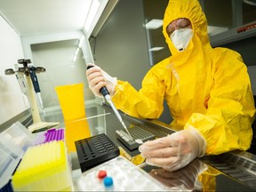 A specialist works at a laboratory of the federal centre for animal health which is working on a vaccine against the COVID-19 for animals, in Vladimir, Russia, Dec. 9, 2020.