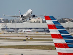 American Airlines flight 718, the first U.S. Boeing 737 MAX commercial flight since regulators lifted a 20-month grounding in November, takes off from Miami, Fla. Dec. 29, 2020.