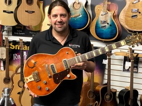 Mike Miltimore, seen in Kamloops, B.C., in an undated handout photo, says the Gretsch electric guitar that a woman brought into his store is from 1955 and similar to one played by country music legend Chet Atkins before he developed his signature series of guitars.