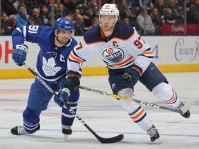 Oilers' Connor McDavid skates against Leafs' John Tavares during a game last season.