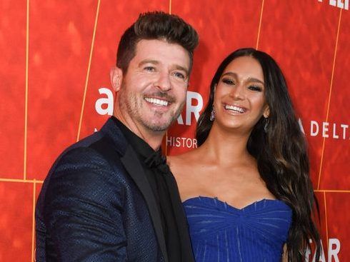 'NO MAN OWNS MY BODY': Robin Thicke's fiancee defends nude baby bump