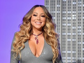 US singer Mariah Carey participates in the ceremonial lighting of the Empire State Building in celebration of the 25th anniversary of "All I Want For Christmas Is You" on December 17, 2019 in New York City.