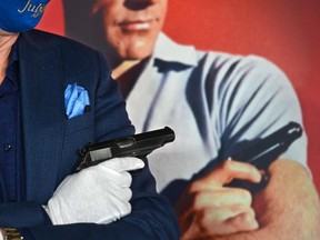 The Walther PP handgun used by Sean Connery as James Bond, 007, in the first James Bond film, "Dr. No" (1962) is displayed at a press preview of Julien's Auctions Presents Icons And Idols: Rock 'N' Roll, Hollywood and Sports, November 24, 2020 in Beverly Hills, California.