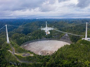 This file aerial view shows the Arecibo Observatory in Arecibo, Puerto Rico on November 19, 2020.