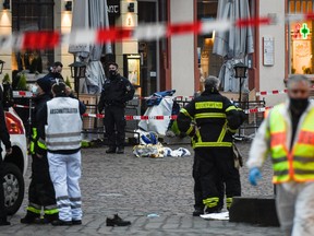 Police and ambulances work at the scene where a car drove into pedestrians in Trier, southwestern Germany, on Dec. 1, 2020.