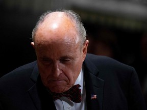 In this file photo taken on December 31, 2019 US President Donald Trump's personal lawyer Rudy Giuliani arrives for a New Year's celebration at Mar-a-Lago in Palm Beach, Florida.