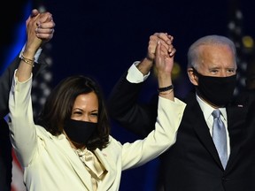 In this file photo taken on November 7, 2020 U.S. President-elect Joe Biden and Vice President-elect Kamala Harris stand onstage after delivering remarks in Wilmington, Delaware, after being declared the winners of the presidential election.