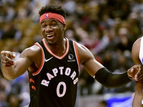 Raptors guard Terence Davis laughs during second half NBA basketball action against the Orlando Magic, in Toronto, Wednesday, Nov. 20, 2019.
