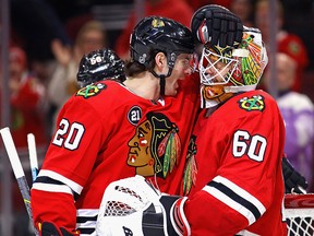 Brandon Saad of the Chicago Blackhawks congratulates Collin Delia at the United Center on January 20, 2019 in Chicago.