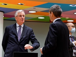 European Union's chief Brexit negotiator Michel Barnier gestures as he speaks with Ambassador Michael Clauss, Permanent Representative of Germany to the EU, during a meeting of the Committee of the Permanent Representatives of the Governments of the Member States to the European Union (COREPER) in Brussels, Belgium December 22, 2020.
