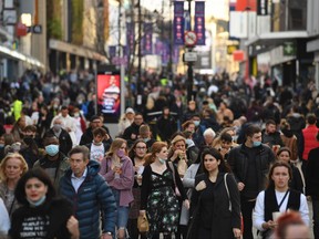 Shoppers and pedestrians fill Northumberland Street in Newcastle-upon-Tyne, in north-east England on Dec. 19, 2020, on the last Saturday before Christmas.