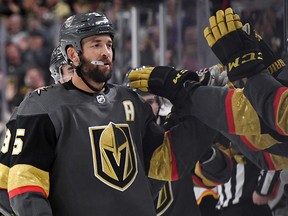 Deryk Engelland of the Vegas Golden Knights celebrates with teammates after scoring against the Calgary Flames at T-Mobile Arena on March 6, 2019 in Las Vegas.