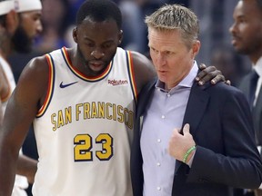 Draymond Green, left, of the Golden State Warriors talks to head coach Steve Kerr during their game against the San Antonio Spurs at Chase Center on Nov. 1, 2019 in San Francisco, Calif.