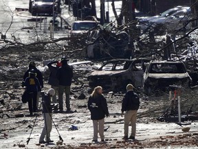 Investigators work near the site of an explosion on 2nd Avenue that occurred the day before in Nashville, Tennessee, U.S. December 26, 2020. REUTERS/Harrison McClary ORG XMIT: GGG-NAS122