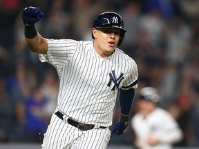 Gio Urshela of the New York Yankees celebrates his walk-off RBI single against the Tampa Bay Rays at Yankee Stadium on May 17, 2019 in New York.