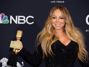 Mariah Carey poses in the press room with her Icon Award during the 2019 Billboard Music Awards at the MGM Grand Garden Arena on May 1, 2019, in Las Vegas, Nevada.