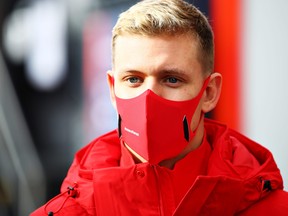 Mick Schumacher of Germany and Alfa Romeo Racing looks on in the Paddock before the F1 Eifel Grand Prix at Nuerburgring on Oct.11, 2020 in Nuerburg, Germany.