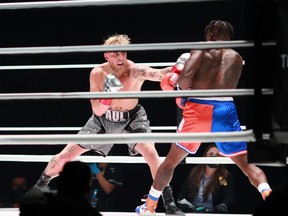 Jake Paul (grey trunks) fights Nate Robinson (red and blue trunks) during a cruiserweight boxing bout at the Staples Center in Los Angeles, Nov. 28, 2020.