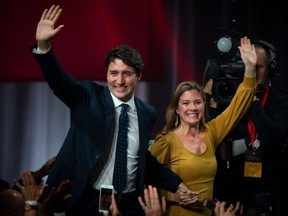 In this file photo taken Oct. 21, 2019, Justin Trudeau and his wife Sophie Grégoire Trudeau arrive to celebrates his victory with his supporters at the Palais des Congres in Montreal during Team Justin Trudeau 2019 election night event in Montreal.