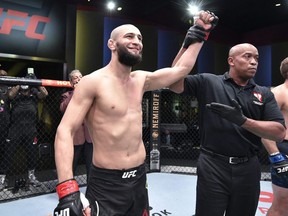 In this handout image provided by UFC, Khamzat Chimaev of Chechnya celebrates after his knockout victory over Gerald Meerschaert in their middleweight bout during the UFC Fight Night event at UFC APEX in Las Vegas, Sept. 19, 2020.