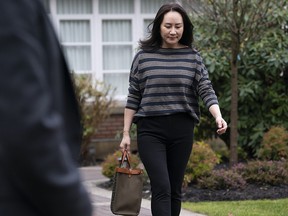 Chief financial officer of Huawei, Meng Wanzhou, leaves her home in Vancouver on Wednesday, Nov. 25, 2020.