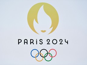 This picture taken on October 21, 2019 shows a logo during a presentation ceremony for Paris 2024 Olympic Games at the Grand Rex cinema in Paris.