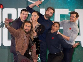 "Justice League" actors (from from bottom left to right) Jason Momoa, Ezra Miller, Gal Gadot, Ben Affleck, Ray Fisher and Henry Cavill attend the film's London premiere on Nov. 4, 2017.