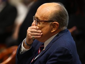 U.S. President Donald Trump's personal attorney Rudy Giuliani waits to testify before the Michigan House Oversight Committee in Lansing, Mich., Dec. 2, 2020.