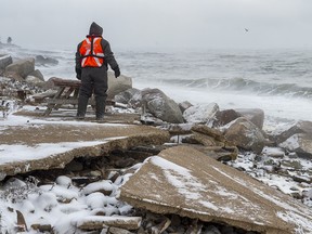 A member of a ground search and rescue team walks along the shore of the Bay of Fundy in Hillsburn, N.S on Wednesday, Dec. 16, 2020.