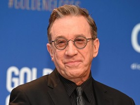 Actor Tim Allen sits on stage ahead of the 77th Annual Golden Globe Awards nominations announcements at the Beverly Hilton hotel in Beverly Hills, Calif., Dec. 9, 2019.