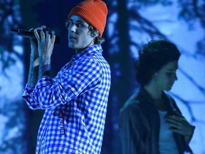 In this handout image courtesy of ABC singers Shawn Mendes, right, and Justin Bieber, left, perform during the 2020 American Music Awards at the Microsoft theatre on Nov. 22, 2020 in Los Angeles.