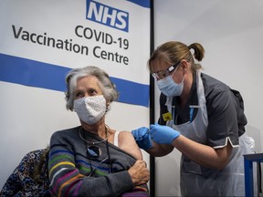 Dr. Doreen Brown, 85, receives the first of two Pfizer/BioNTech Covid-19 vaccine jabs at Guy's Hospital at the start of the largest ever immunization program in the U.K.'s history on Dec. 8, 2020 in London.