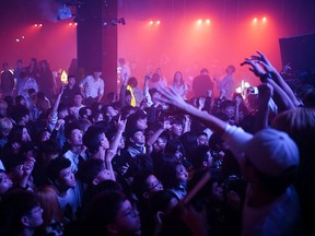 People dance at a nightclub, almost a year after the global outbreak of the coronavirus disease (COVID-19) in Wuhan, China, December 12, 2020.
