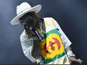 In this file photo taken on May 31, 2019 Lil Wayne performs onstage at the 2019 Governors Ball Music Festival on Randall's Islandin New York City.