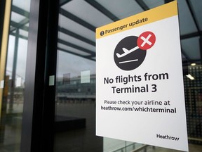 A sign alerts travels to the closure of Terminal 3 at Heathrow Airport in west London on December 21, 2020, as a string of countries around the world banned travellers arriving from the UK, due to the rapid spread of a new, more-infectious coronavirus strain.