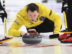 Team Manitoba skip Jason Gunnlaugson delivers while taking on Quebec at the Brier in Kingston, Ont., on Sunday, March 1, 2020. THE CANADIAN PRESS/Sean Kilpatrick