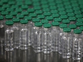 Vials of AstraZeneca's COVISHIELD, coronavirus disease (COVID-19) vaccine, are seen before they are packaged inside a lab at Serum Institute of India, Pune, India, November 30, 2020.