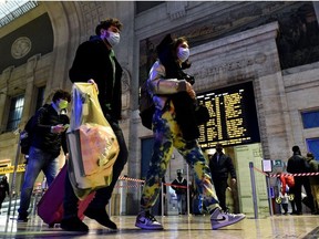 People flock to Milan's Centrale train station to travel out of the city ahead of the tight restrictions on movement during the Christmas period put in place as part of efforts to curb the spread of the coronavirus disease (COVID-19), in Milan, Italy,