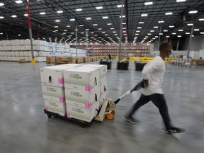 Boxes containing the Moderna COVID-19 vaccine are prepared to be shipped at the McKesson distribution center in Olive Branch, Mississippi, U.S. December 20, 2020.