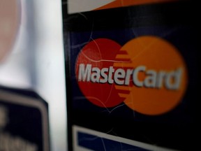 A sticker shows that a store accepts MasterCard in Harvard Square in Cambridge, Massachusetts, U.S., July 25, 2018.