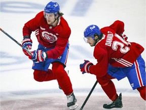Josh Anderson and Phillip Danault cut across centre ice during Montreal Canadiens training-camp scrimmage at the Bell Sports Complex in Brossard on Jan. 7, 2021.