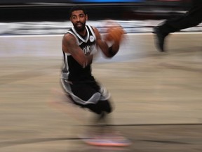 Kyrie Irving of the Brooklyn Nets dribbles against the Utah Jazz during their game at Barclays Center on January 05, 2021 in New York City.