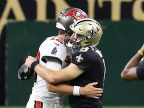 Tampa Bay's Tom Brady (left) hugs Drew Brees of the New Orleans Saints after a game earlier this season.