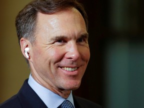 Minister of Finance Bill Morneau waits to do a television interview about the Economic and Fiscal Snapshot on Parliament Hill in Ottawa, July 8, 2020.