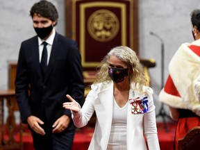 Governor General Julie Payette leaves with Prime Minister Justin Trudeau after the throne speech in the Senate chamber in Ottawa September 23, 2020.