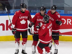 Canada's Dylan Cozens (22) celebrates his goal with teammates against Finland during first period IIHF World Junior Hockey Championship action on Thursday, Dec. 31, 2020 in Edmonton.