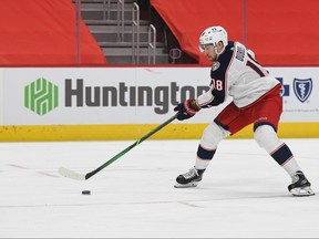 Columbus Blue Jackets center Pierre-Luc Dubois (18) brings the puck up ice to score a goal against the Detroit Red Wings during the third period at Little Caesars Arena in Detroit on Jan. 18, 2021.