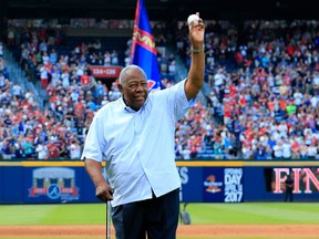 Baseball Hall of Famer Hank Aaron throws out the ceremonial last pitch at Turner Field on Oct. 2, 2016. Aaron passed away on Friday at the age of 86.