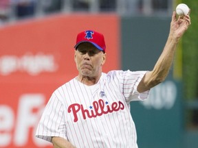 Actor Bruce Willis throws out the first pitch prior to a game between the Brewers and Phillies at Citizens Bank Park in Philadelphia, May 15, 2019.
